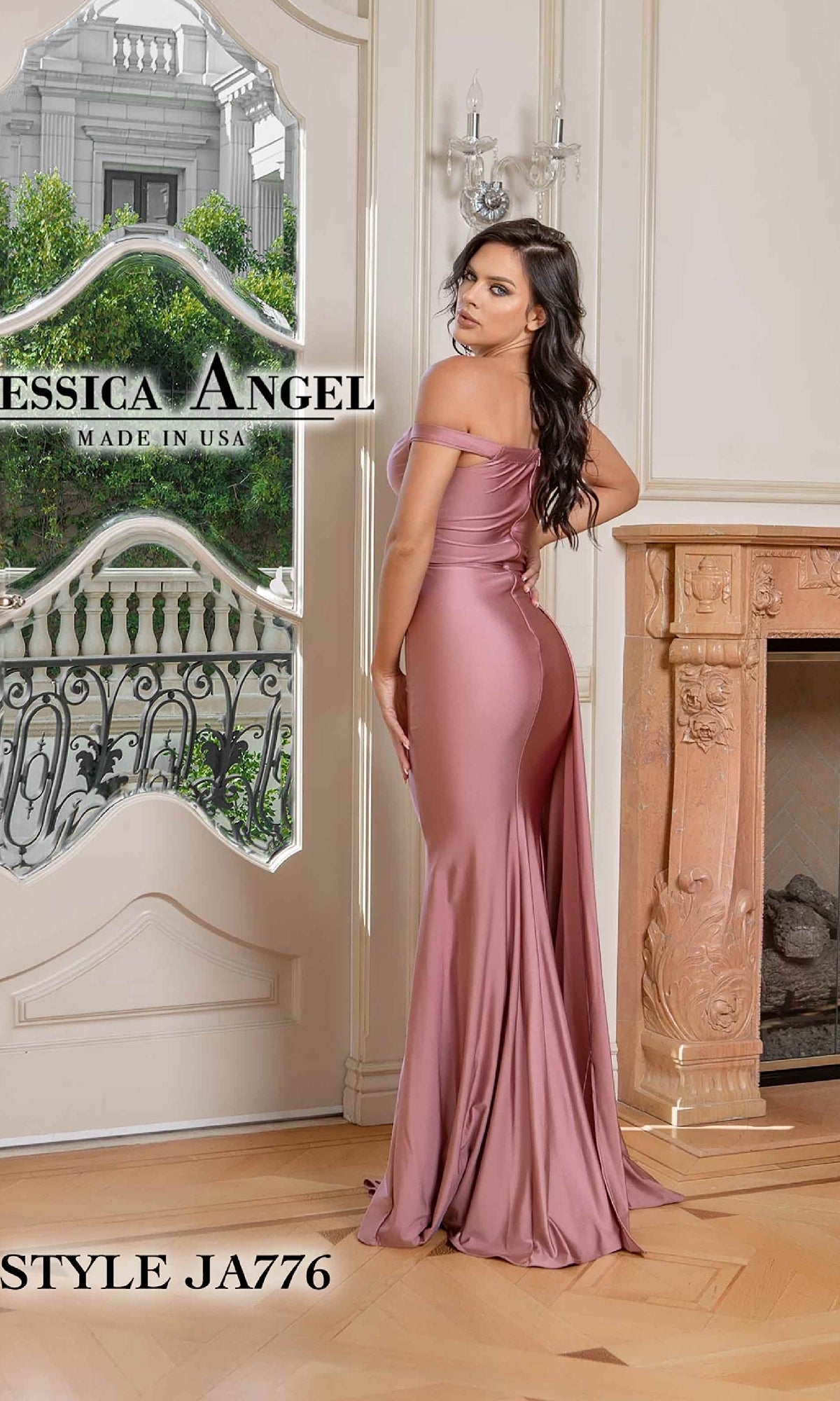 A woman in a mauve, off-the-shoulder Side-Drape Long Prom Dress (Jessica Angel 776) stands indoors beside a beige fireplace, glancing over her shoulder. Text on image: